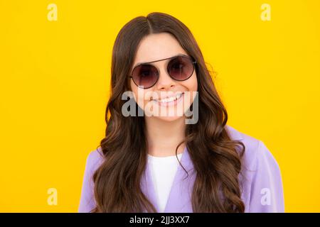 Headshot portrait of teenager child girl isolated on studio background. Childhood lifestyle concept. Mock up copy space. Stock Photo