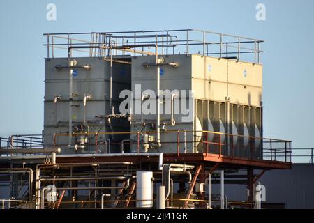 Rooftop cooling tower with safe access gantry and steel ladders and steps   at a manufacturing facility for the production of beer Stock Photo