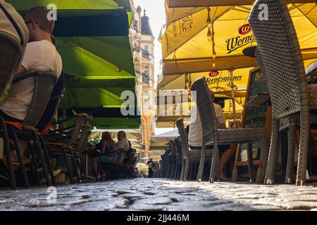 Leipzig, Germany - June 25, 2022: The 'Barfussgaesschen' in downtown Leipzig. Popular and known for its many bars and all year outdoor seating. People Stock Photo