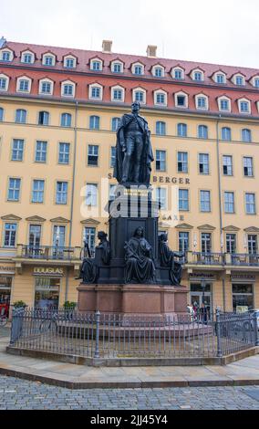 Dresden, Germany - June 28, 2022: Statue of Friedrich August II on Dresden's Neumarkt in front of the famous Steigenberger Hotel de Saxe. Monument of Stock Photo