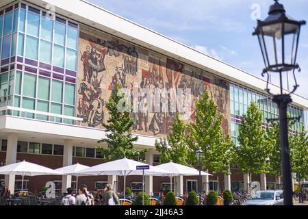 Dresden, Germany - June 28, 2022: View of the Kulturpalast Dresden, Palace of culture, with a large mural, titled 'the way of the red flag'. Artwork m Stock Photo