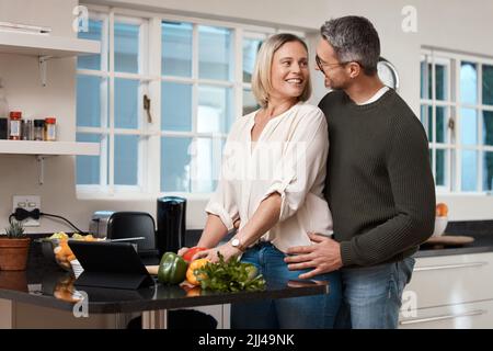 Im dont know what youre cooking but I know whats for dessert. a mature couple cooking together at home. Stock Photo