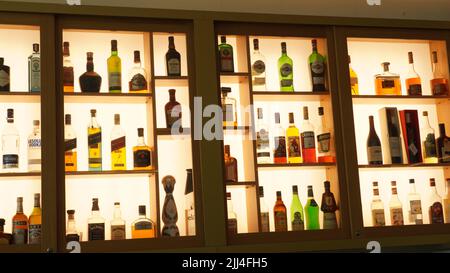 Ein-Bokek, Israel - JULY 6:Different brands of booze,  or alcohol in a bar or tavern. Multiple bottles of adult beverages. Wine, whisky, liquor in the Stock Photo