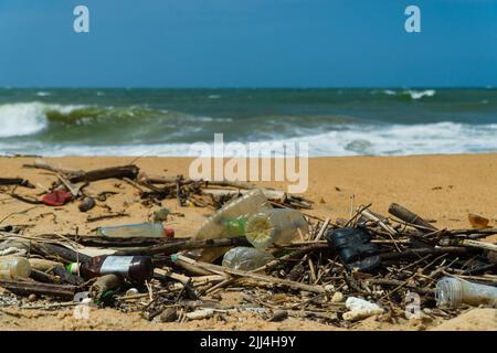 Discarded plastic debris trash pollution after sea swell storm, environmental nature waste. Negombo, Sri Lanka. Stock Photo