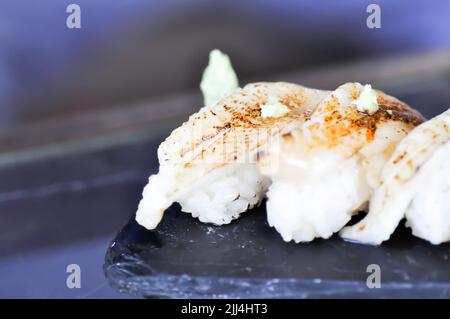 sushi or engawa sushi or fish sushi, rice topped with engawa or fish rolls and wasabi Stock Photo