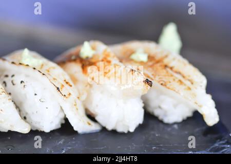 sushi or engawa sushi or fish sushi, rice topped with engawa or fish rolls and wasabi Stock Photo