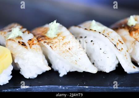 sushi or engawa sushi or fish sushi, rice topped with engawa or fish rolls and wasabi Stock Photo