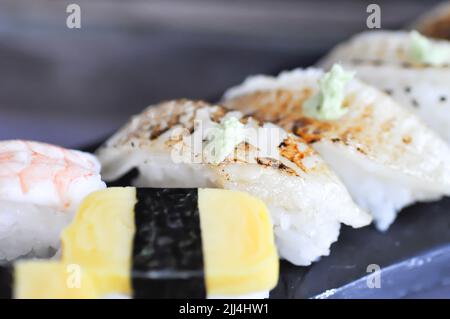 sushi or engawa sushi or fish sushi, rice topped with engawa or fish rolls and wasabi Stock Photo