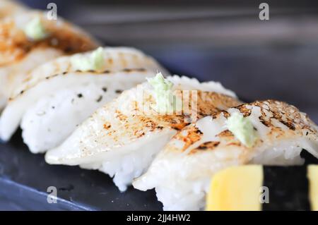 sushi or engawa sushi or fish sushi, rice topped with engawa or fish rolls and wasabi Stock Photo