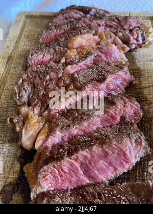 Meat Prime Cuts On A Wooden Table Against A Dark Black Background Stock 