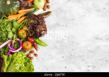 Different vegetables on grey cement background. Healthy eating concept. Top view. Stock Photo