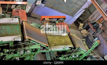 Ooty,Tamilnadu,India-April 30 2022: Assembly line of processing of tea leaves by machines from raw material leaves to finished tea power. Leaves are t Stock Photo