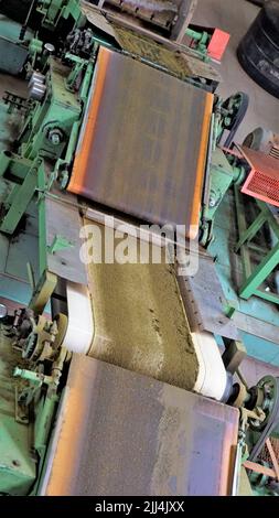 Ooty,Tamilnadu,India-April 30 2022: Assembly line of processing of tea leaves by machines from raw material leaves to finished tea power. Leaves are t Stock Photo