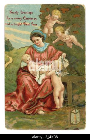 Original embossed Edwardian era Christmas greetings and Happy New Year illustrated colour postcard of Mary holding the infant Jesus, posted  /dated  21 December 1910 Stock Photo