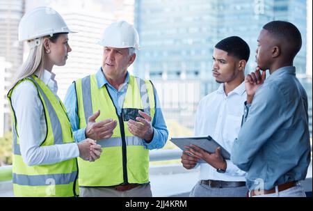 Your feedback matters to me. a team of architects having a meeting. Stock Photo