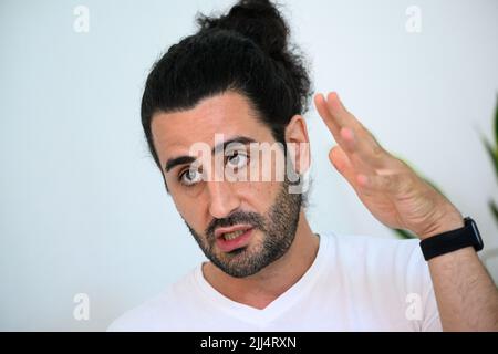 Berlin, Germany. 19th July, 2022. Orkan Özdemir (SPD), member of the Berlin House of Representatives and spokesman for anti-racism and integration for the SPD parliamentary group, sits in his constituency office in Friedenau during an interview with Deutsche Presse-Agentur dpa. (to dpa 'SPD: There is still room for improvement in voting rights for non-Germans') Credit: Bernd von Jutrczenka/dpa/Alamy Live News Stock Photo