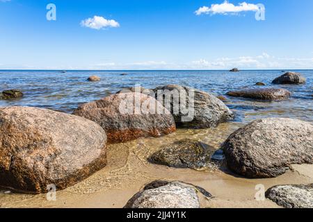 Shoreline in the baltic sea during summer with boulders Stock Photo