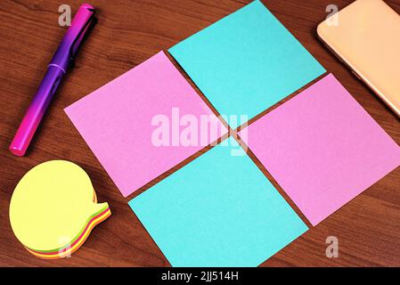 Important Informations Written On Four Different Notes On Desk With Cellphone. Crutial Messages On Memos On Table With Pencil. Critical Announcements Stock Photo