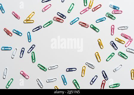 Colorful Paperclips Placed Around Important Information. Colored Clips Arranged In Circle With Crutial Announcement Inside. Staples With Recent Ideas Stock Photo