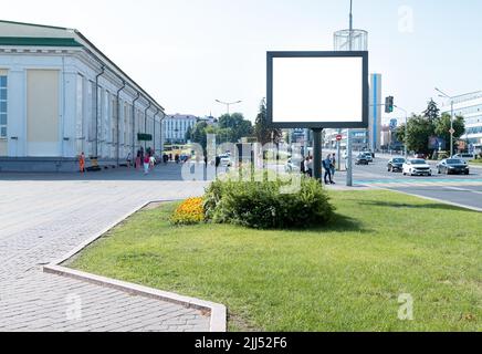 Large billboard mockup along city highway. Brand, product, service, business ad in high traffic area. Hoarding. Out of home advertising. Summer downtown with pedestrians and drivers. photo Stock Photo