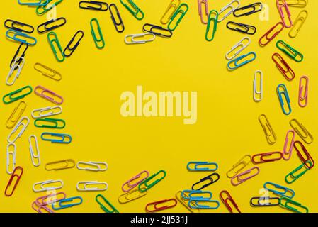 Colorful Paperclips Placed Around Important Information. Colored Clips Arranged In Circle With Crutial Announcement Inside. Staples With Recent Ideas Stock Photo