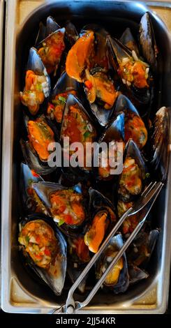 Delicious mussels in a cooling container in a restaurant Stock Photo