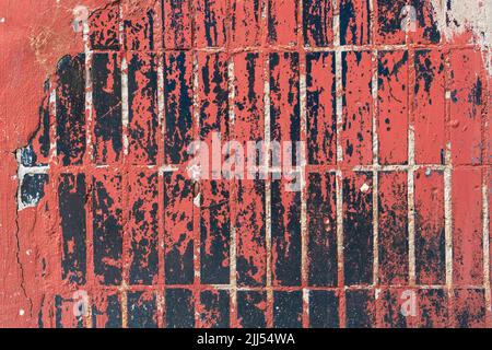 Old brick tile wall texture of the house, cracks, signs of wear and dirt. Stock Photo