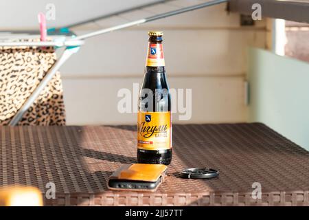 RUSSIA, CRIMEA - JUN 29, 2022: Zhiguli up beer motion russian slow cheers party hands group, concept alcohol lager for cold from froth bar, clear Stock Photo