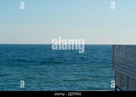 Beach sea beautiful water white view sand coastline surface top, from ocean blue in landscape for vacation clear, liquid natural. Island sunbeam scene Stock Photo