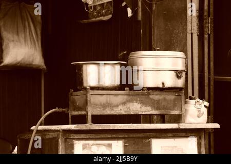 A gas stove with utensils at a small shop in Kasauli. Stock Photo