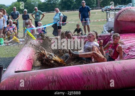 Abington Park, Northampton, UK. 23rd July 2022. Race for Life Pretty Muddy, raising funds for Cancer Research, a  obstacle route which meanders through the very scenic Abington Park. Credit: Keith J Smith./Alamy Live News. Stock Photo