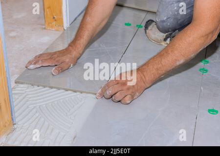 Tile levelling system with plastic clips and wedges Stock Photo
