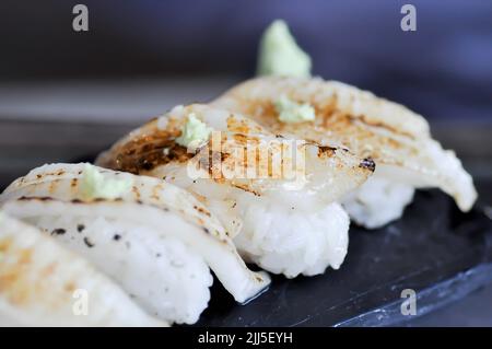 sushi or engawa sushi or fish sushi, rice topped with engawa or fish rolls and wasabi Stock Photo