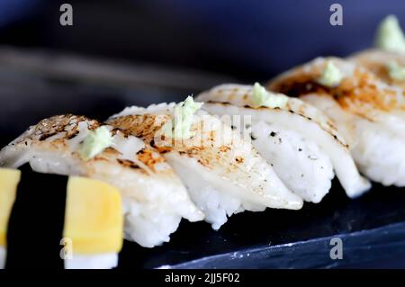 sushi or engawa sushi or fish sushi, rice topped with engawa or fish rolls and wasabi Stock Photo