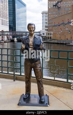 Milwaukee, WI, USA April 19 2022: Refurbished Bronze Fonz statue Happy Days character tribute in downtown Milwaukee, Wisconsin Stock Photo