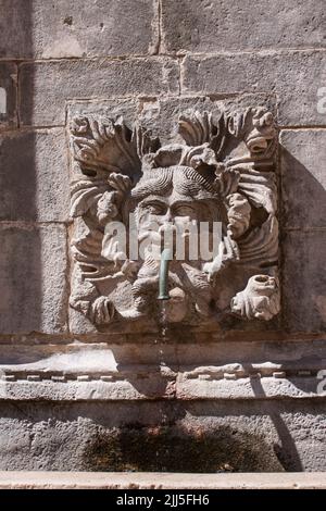 Ancient fountain with drinking water in shape of a bearded male fantasy face in Dubrovnik old city, Croatia. Stock Photo