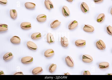 pistachios on a white background close-up top view . High quality photo Stock Photo