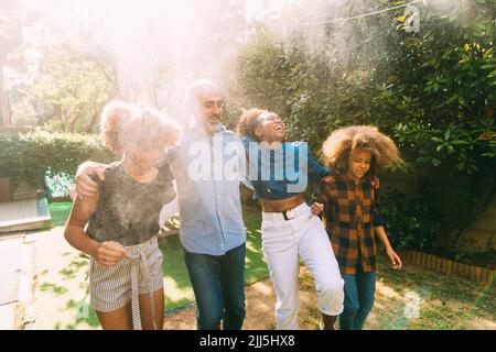 Happy family enjoying together in backyard Stock Photo