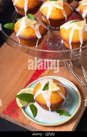 Food Concept Homemade organic mini Lemon cake on wooden board with black copy space Stock Photo