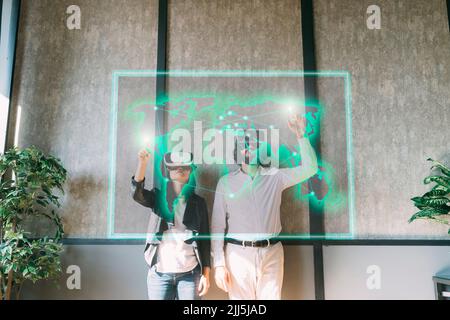 Multiracial business people with VR glasses using virtual visual map Stock Photo