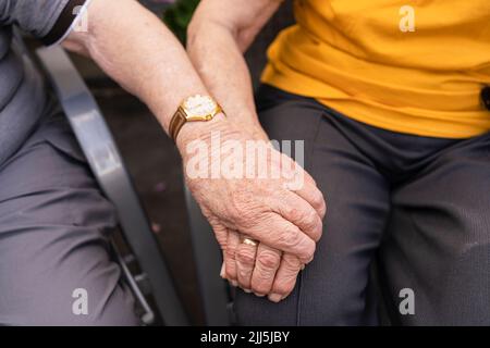 Senior couple holding hands Stock Photo