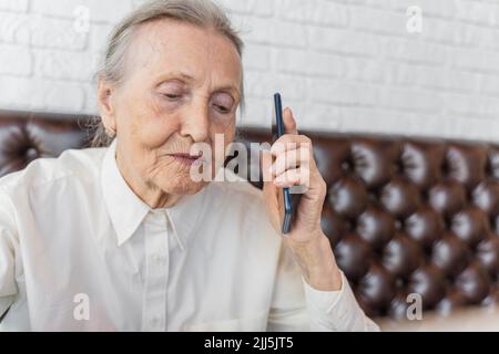 Senior woman talking on mobile phone Stock Photo