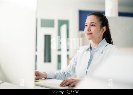Businesswoman working on computer at office Stock Photo