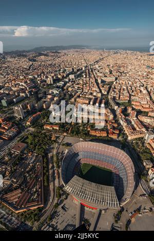 Spain, Catalonia, Barcelona, Helicopter view of Camp Nou stadium and surrounding cityscape Stock Photo