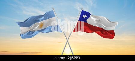 crossed national flags of Chile and Argentina flag waving in wind at ...