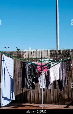 Dorking Surrey Hills UK, July 10 2022, Rotary Clothes Drying Line With Washing Hanging To Dry Stock Photo