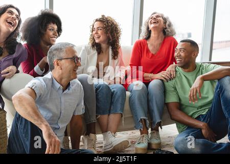 Happy business colleagues having fun in office Stock Photo