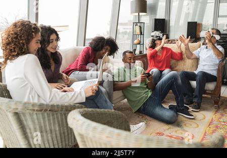 Happy business colleagues sitting together on sofa at office Stock Photo