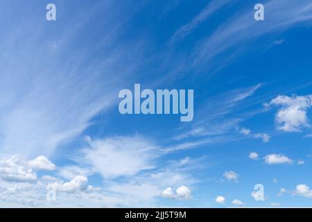 The sky with clouds. White clouds in the blue sky. Blue sky and clouds. Stock Photo