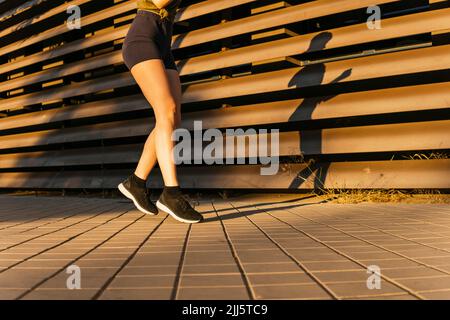 Vigorous energetic woman doing exercise. Young athletic asian woman ...